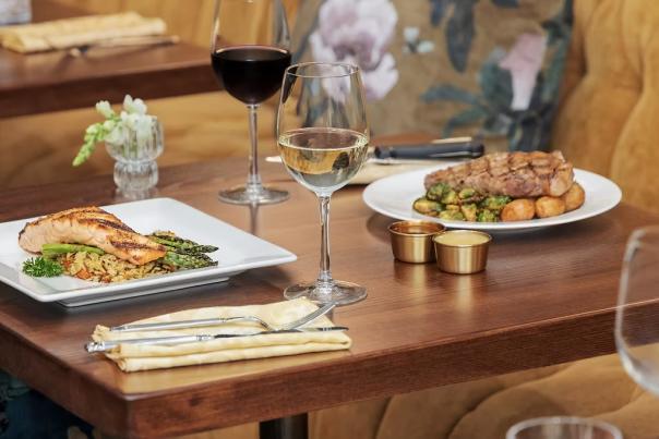 A table with plates of food from Gilded Feather.