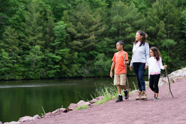 A family enjoys the beautiful hiking trails in the Poconos.