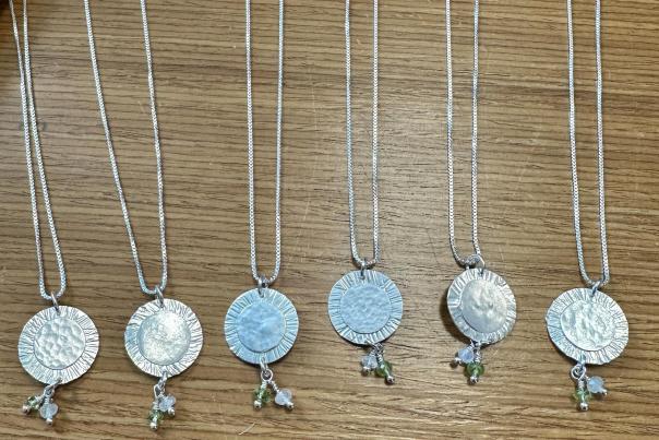 Locally crafted unique eclipse themed pendants from Pam Hurst Designs. Find them at The Sterling Butterfly in downtown Martinsville.