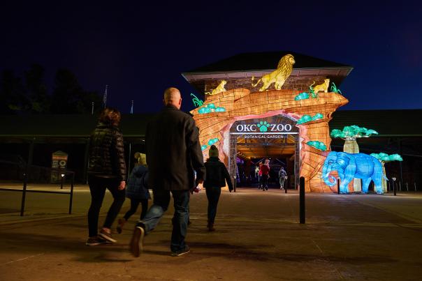 Family walking into the OKC Zoo's Safari Lights entrance