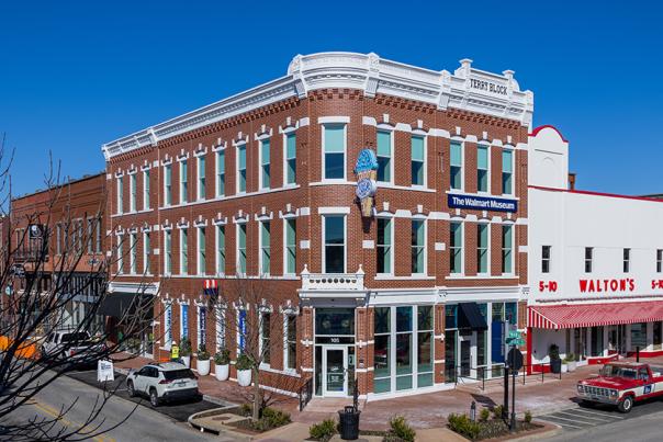 The Walmart Museum and Walton's 5&10 storefront in a historic brick building in downtown Bentonville, Arkansas.