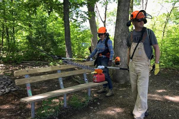 Volunteers in PPE doing trail maintenance