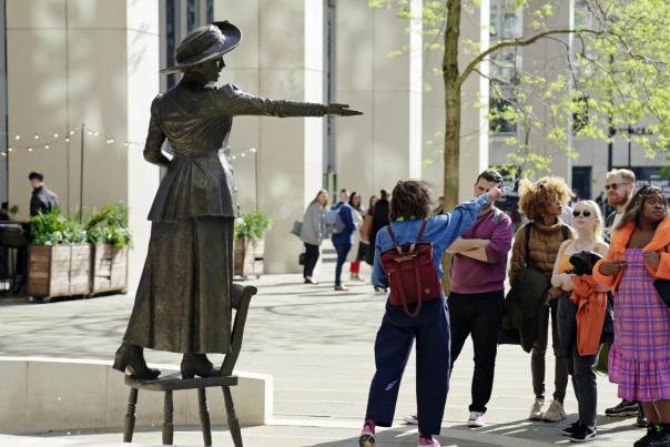 Walking tour group at Emmeline Pankhurst statue in St Peter's Square