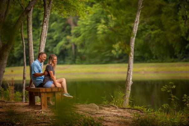 Couple Sitting on Bench at Lake