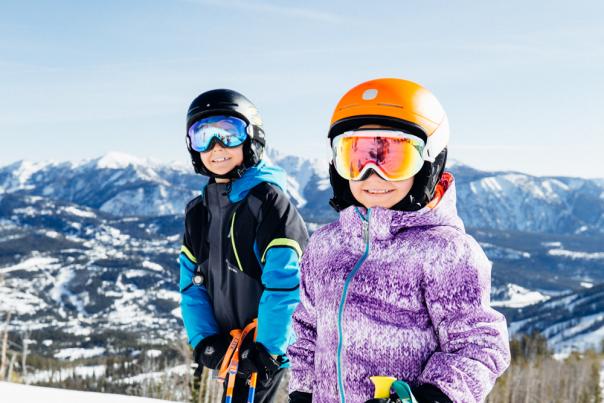 A young boy and girl on the slopes at Big Sky Resort