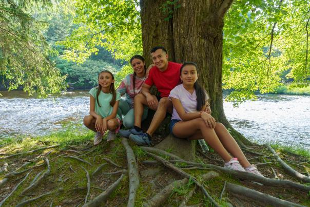 A family enjoys a hike at Austin T Blakeslee Natural Area in the Poconos.