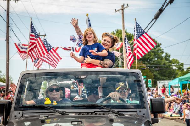Family in truck at 4th of July parade