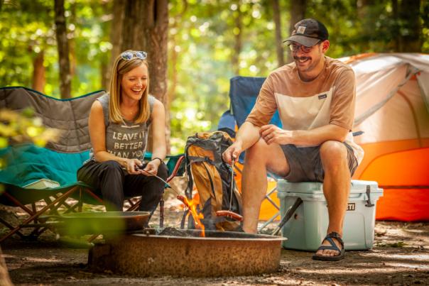 Couple Camping around Fire