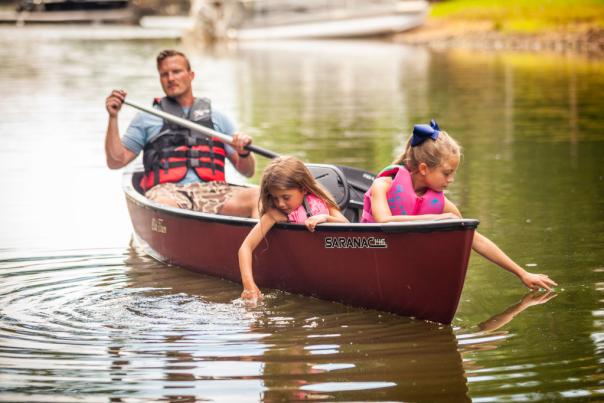 Little girls and dad in canoe