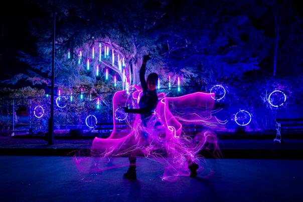 Person in a light up costume at night