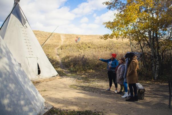 An interpretive guide shows Wanuskewin to visitors