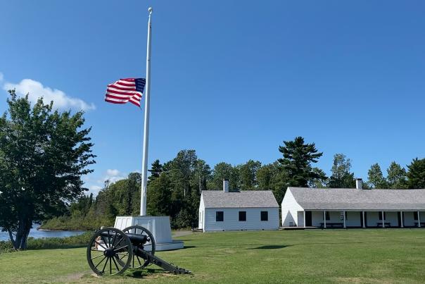 Flag flying at half-mast in Fort Wilkins Historic State Park, located in the Upper Peninsula of Michigan
