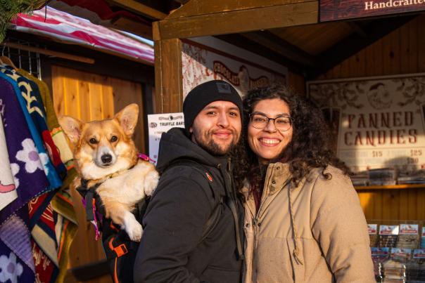Visitors to Christkindlmarket Aurora at RiverEdge Park in Aurora, Illinois