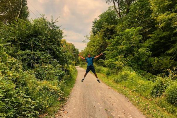 A hiker jumps with excitement along the D&L at Sand Island in Bethlehem, Pa.