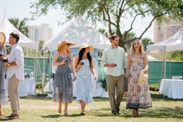 Guests strolling through the UNwineD garden party in Panama City Beach