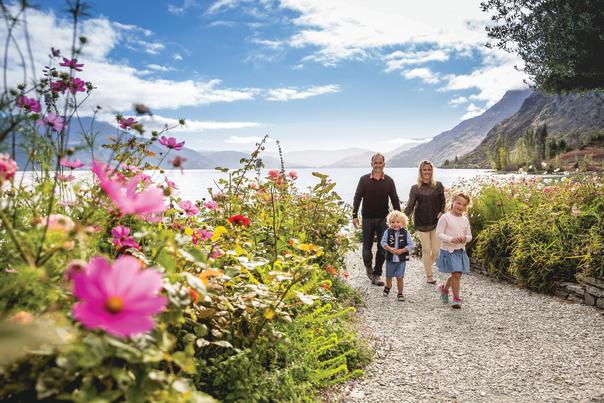 Family walking at Walter Peak in Spring
