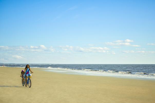 Family biking on East Beach