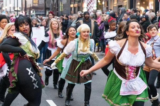Women in dirndls dancing down the street in Cincinnati's Bockfest parade