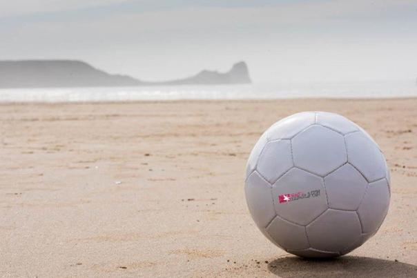 A football on Rhossili beach