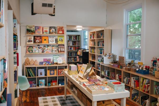 Store with white walls and shelves filled with books