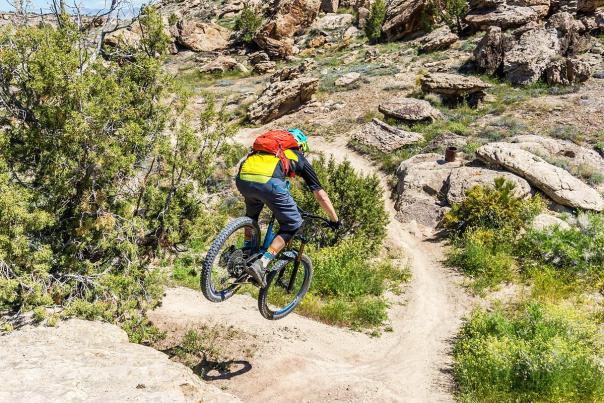 Person Mountain Biking in Lunch Loops Trail System