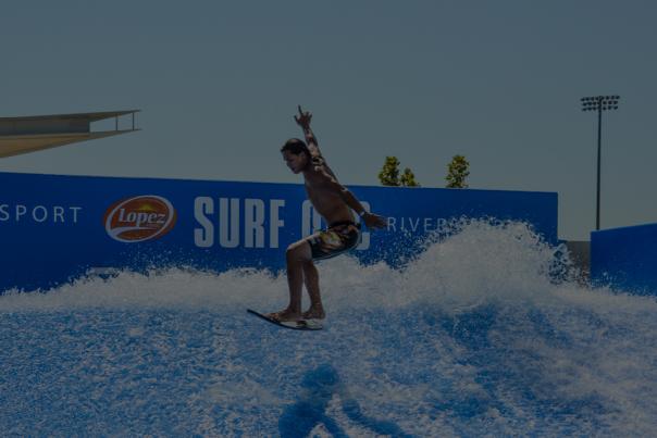 Man surfing at RIVERSPORT's Surf OKC
