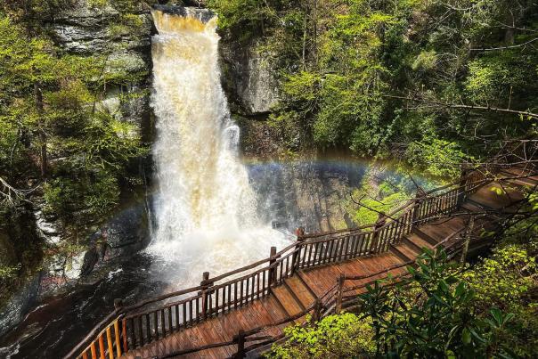 A beautiful rainbow appears above a waterfall in the Poconos.