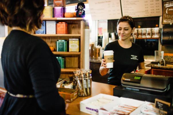 Barista handing coffee to customer at Koco Java in Downtown Salisbury, N.C.