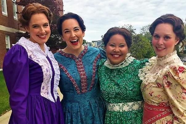 Four women in costume for the Annapolis Opera performance of Little Women