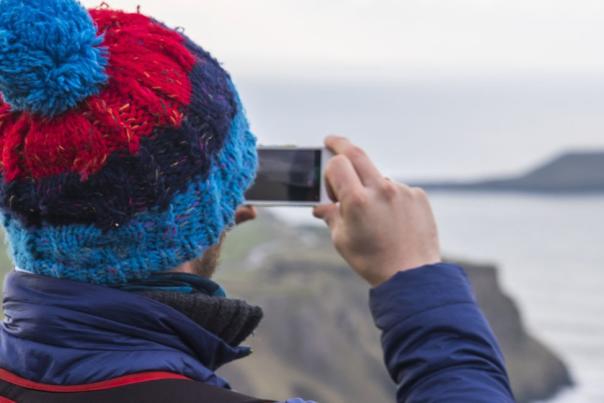 A man taking a photo of Gower