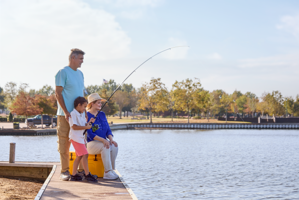 two grandparents fish with their grandson at prien lake park