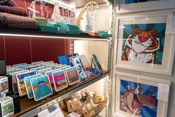 Images shows a display of art themed Cheltenham souvenirs