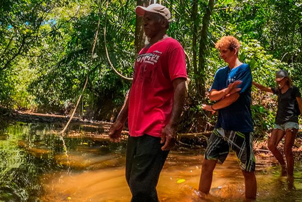 Hikers on a trail in the woods on the Pacific Coast of Veraguas.