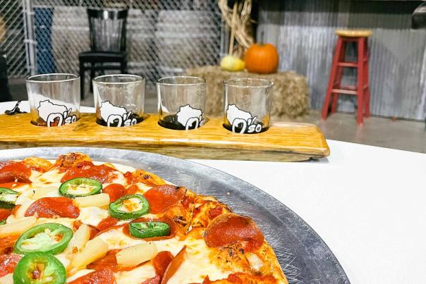 Explore the Stevens Point Area's beer and pizza scene at O'so Brewing with a beer flight and pizza