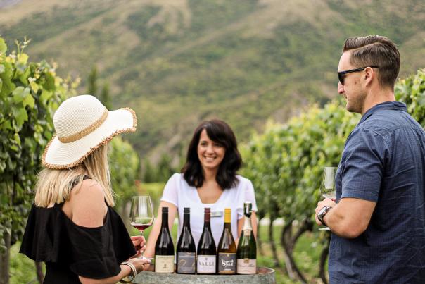 Couple wine tasting at Kinross in the vines with a sommelier