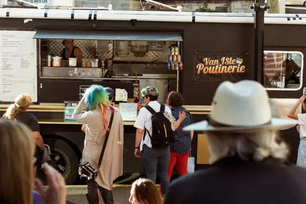 People ordering from a food truck.