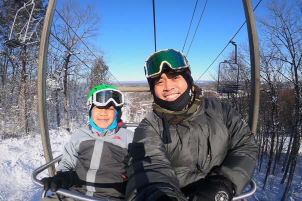 A family rides the ski lift in the Pocono Mountains.