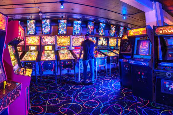 An arcade lit up by neon lights