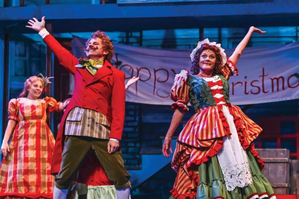 Members if A Christmas Carol on stage in full character