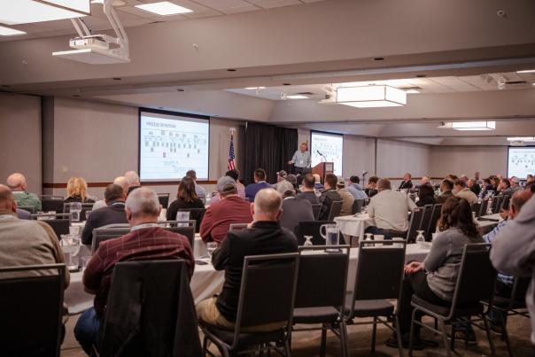 room full of conference attendees