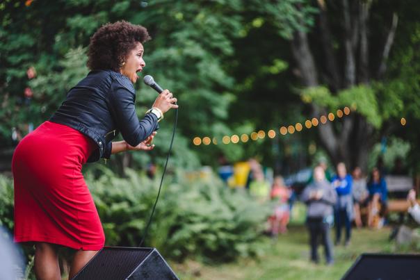 Woman sings at a live music festival in the Keweenaw