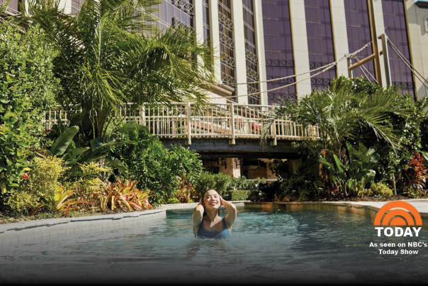 woman swimming in l'auberge pool with today show logo in the bottom corner