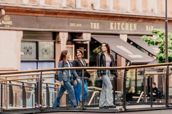 Group of girls walking through Victoria Square