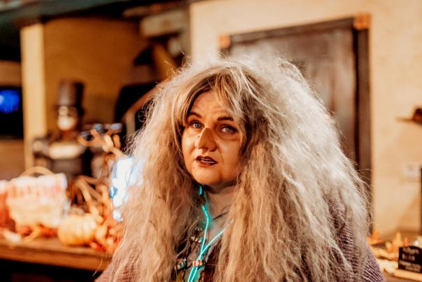 woman in gingerbread hag costume at evermore lore