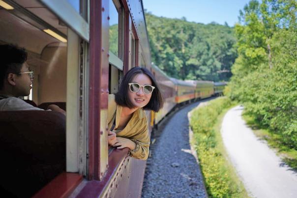 A woman rides the Lehigh Gorge Scenic Railway in Jim Thorpe
