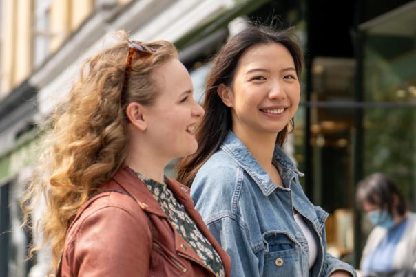 Two women looking in shop windows