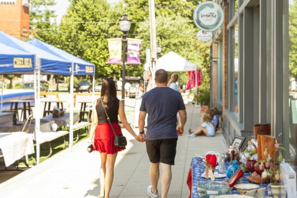 Couple holds hands at Sounds and Sights in Chelsea