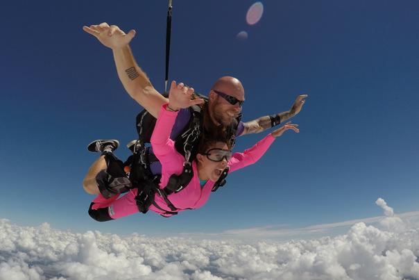 A woman tandem skydives at Skydive Spaceland San Marcos in San Marcos, Texas