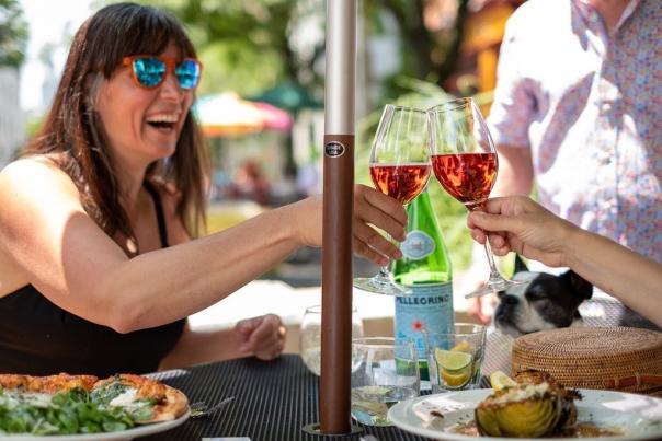 Diners cheers wine glasses on the outdoor patio at Sette Luna in Easton, PA