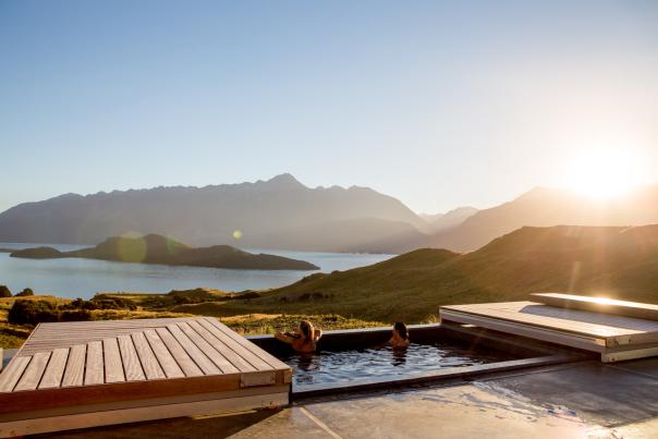 Two women relaxing in the outdoor spa at Aro Ha Wellness Retreat